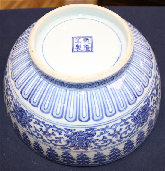 An unusual large Japanese Arita blue and white Kakiemon style bowl, Qianlong mark, 19th century, 30cm, hairline crack